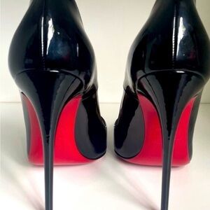 Elegant Black Stilettos with Striking Red Soles